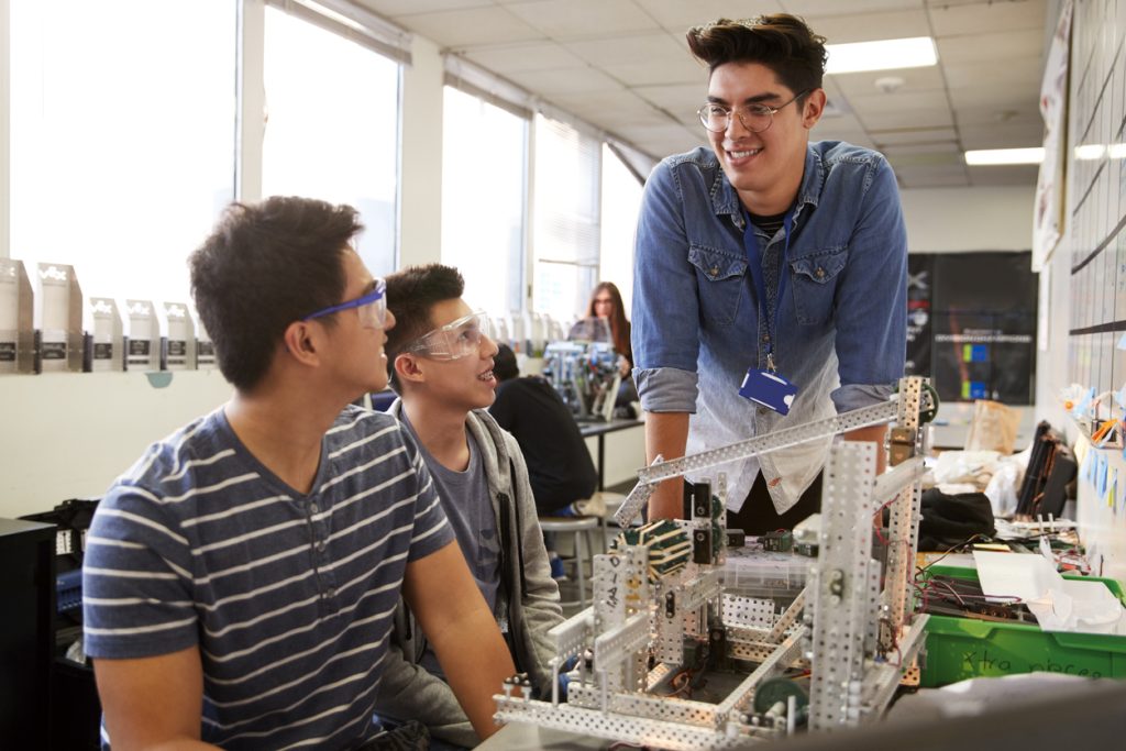 STEM teacher conducting engineering lesson at college