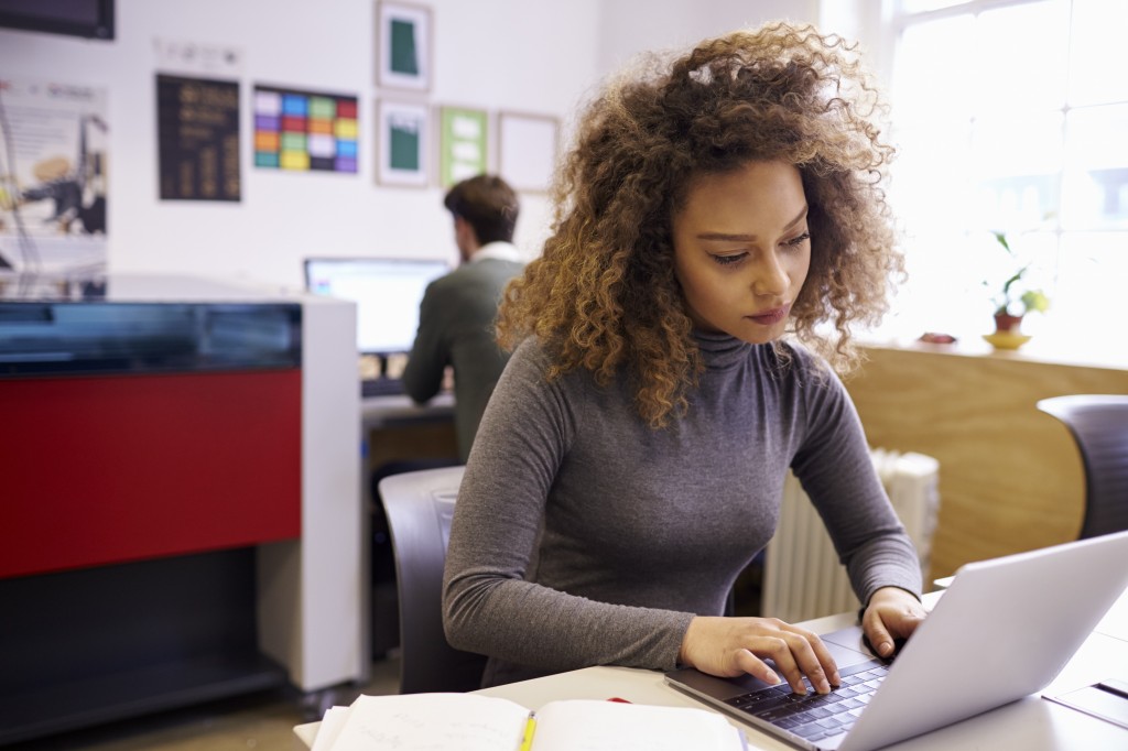 woman typing on computer