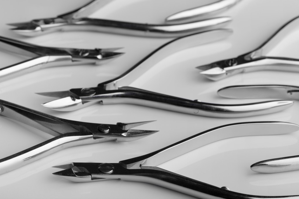 Tools of a manicure scissors on a white background