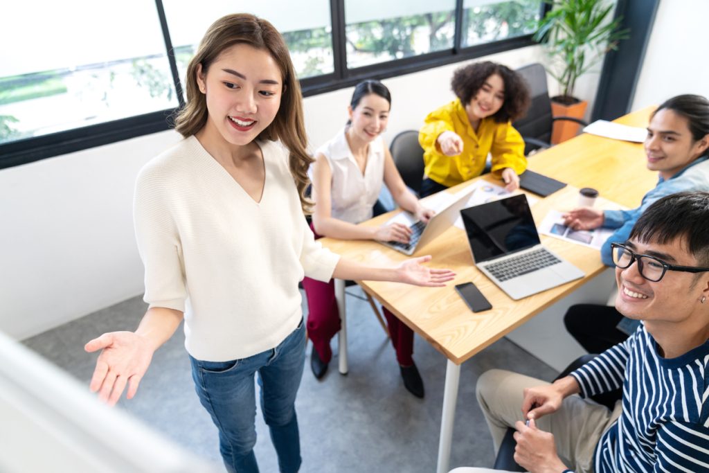 Woman training her employees as part of an upskilling scheme