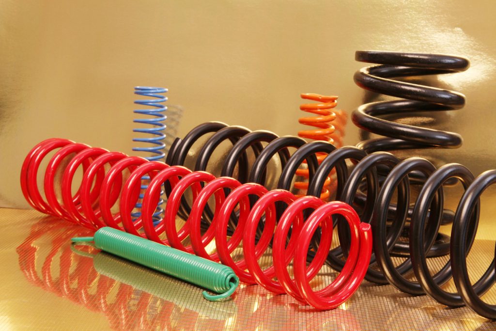 An array of different coloured compression springs