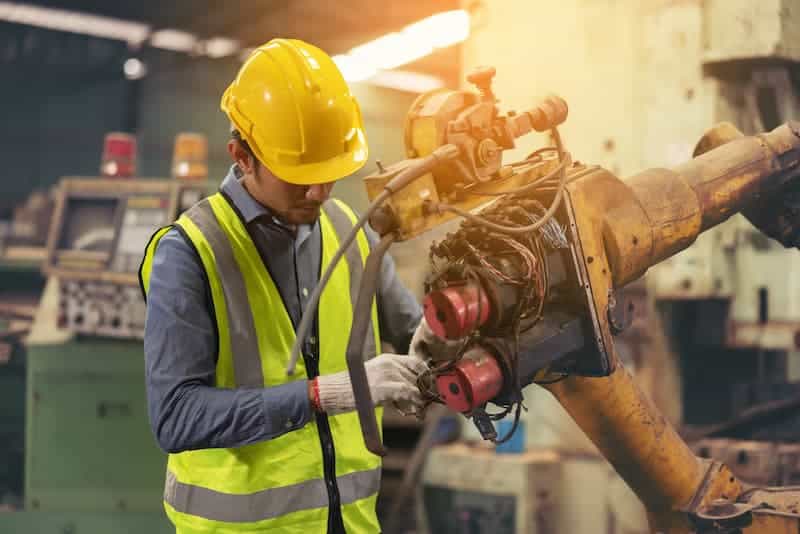 Apprentice repairing machinery