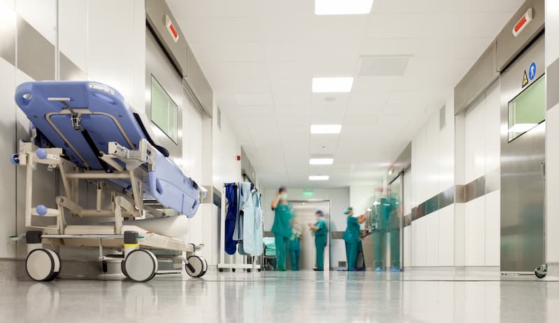 Hospital corridor with beds