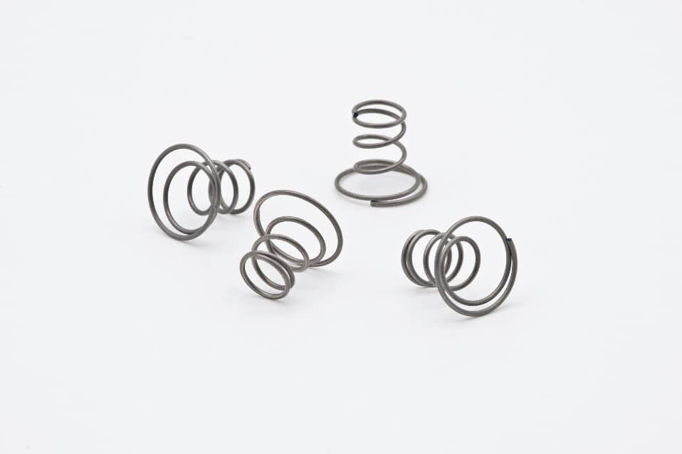 Four metal springs with white background