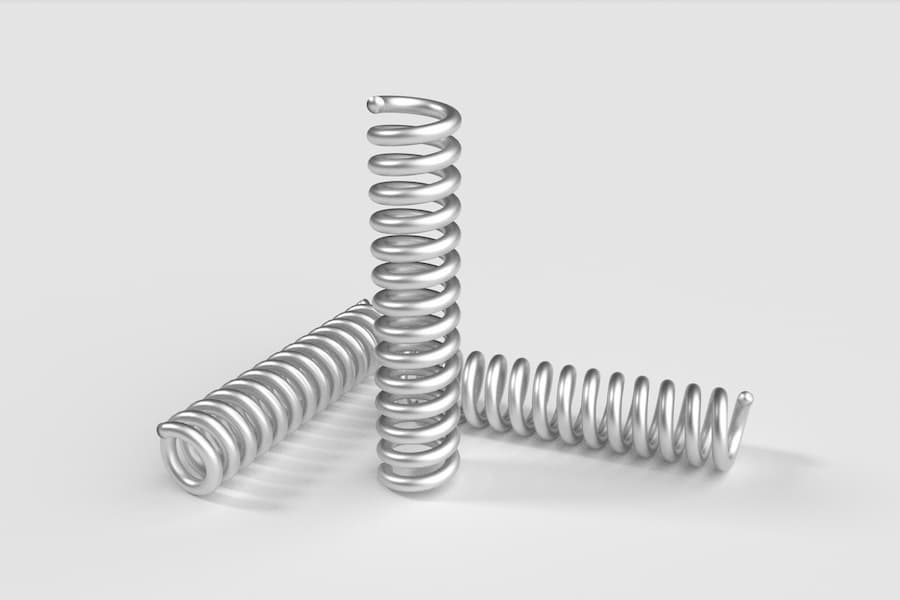 Several metal springs on a white background