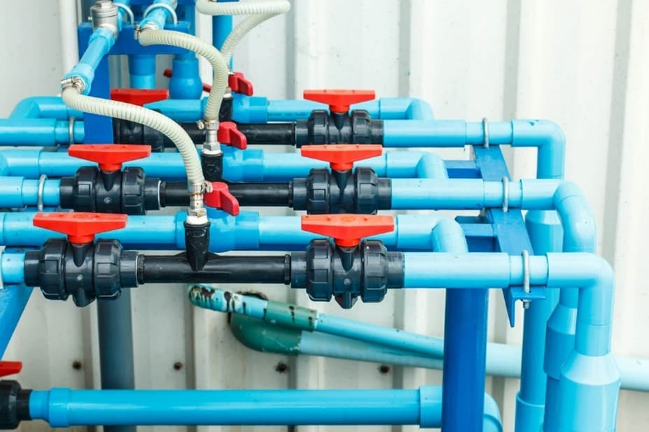 A blue pipes with red valves