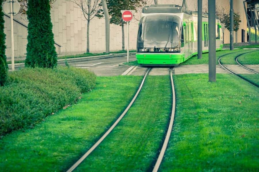 A green train on tracks