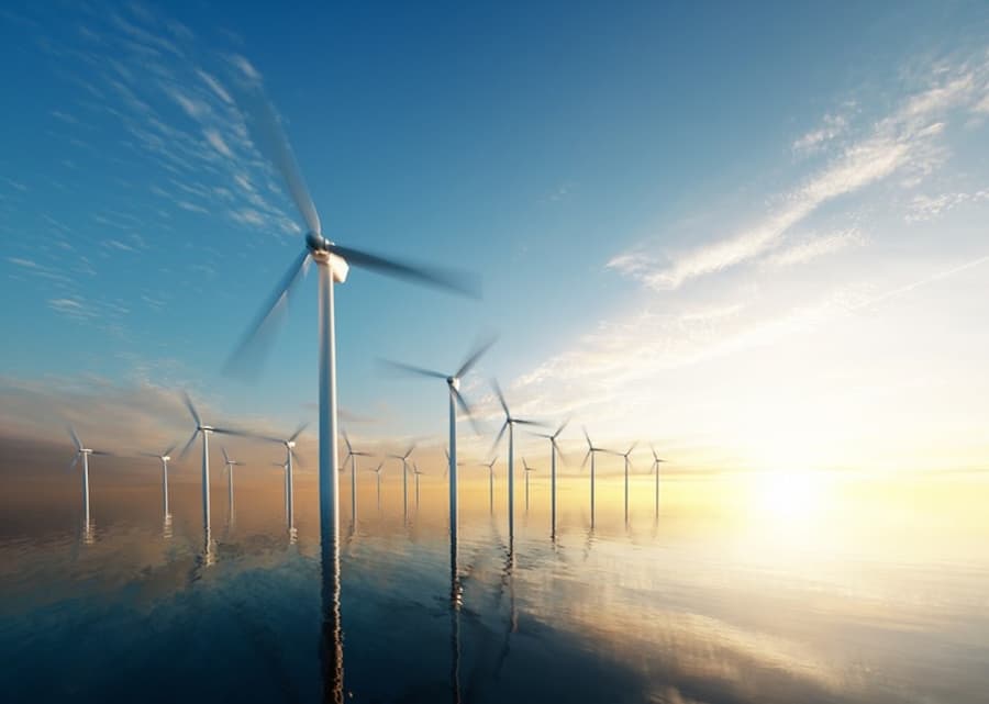 A group of wind turbines in the water